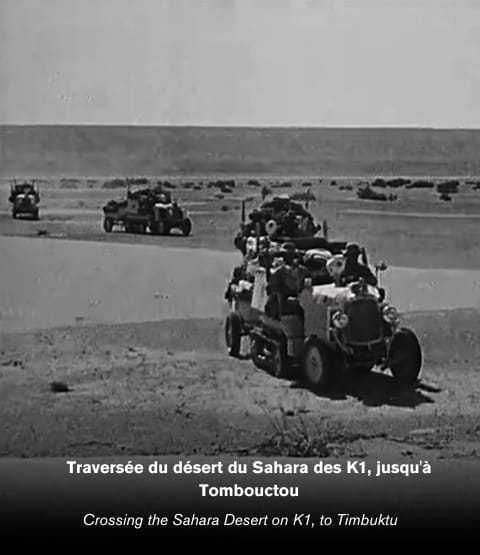 Image of several Citroën-Kégresse K1s crossing the Sahara desert with image description
