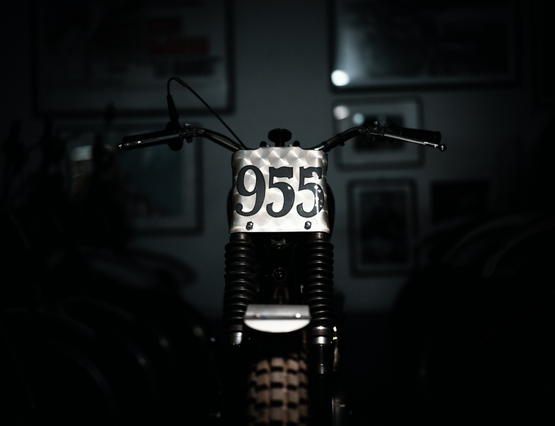 the 955 motorcycle highlighted against a dark background