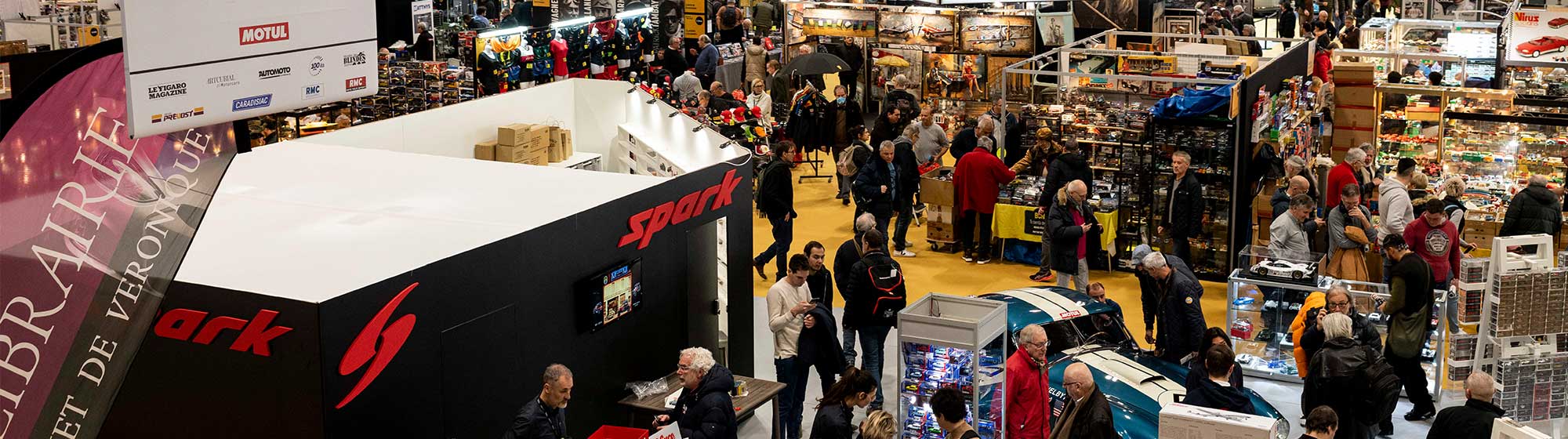 Aerial view of the Rétromobile show with a crowd and stands